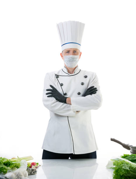 Chef cook in protective medical mask stock photo