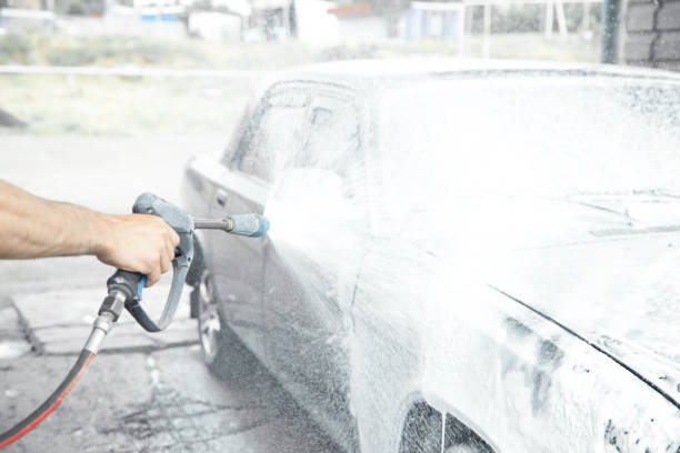 istock Car washing. The washing process on a self service car wash 1218900614