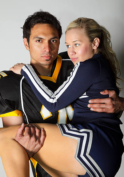 istock Football Player and Cheerleader 121890205