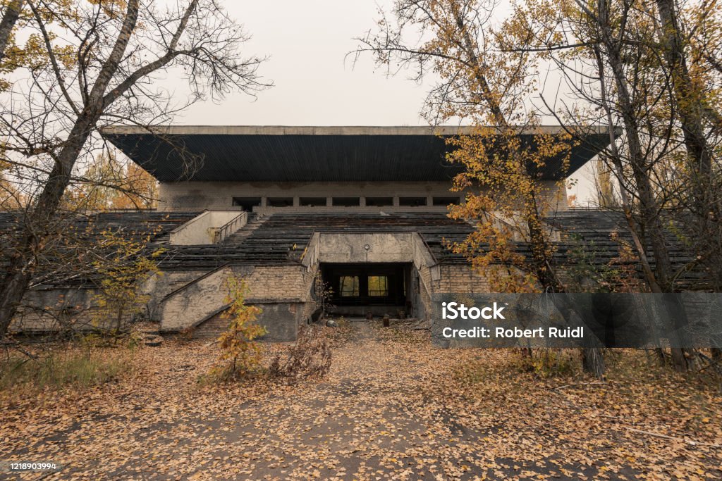 Grandstand of abandoned sports arena in Pripyat, Chernobyl Exclusion Zone in autumn Stadium Stock Photo