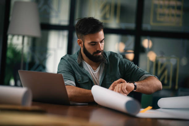 istock Young businessman working on project in office. 1218905141