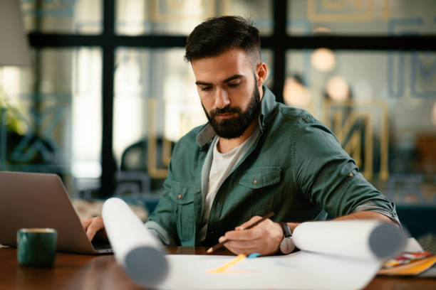 istock Young businessman working on project in office. 1218905206