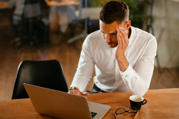 istock Handsome young businessman working in office 1218906053