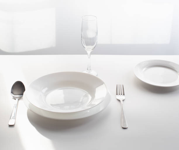 istock cutlery on the table, served by the window in an empty restaurant. as a concept for closing public spaces and restaurants during a pandemic. 1218906145