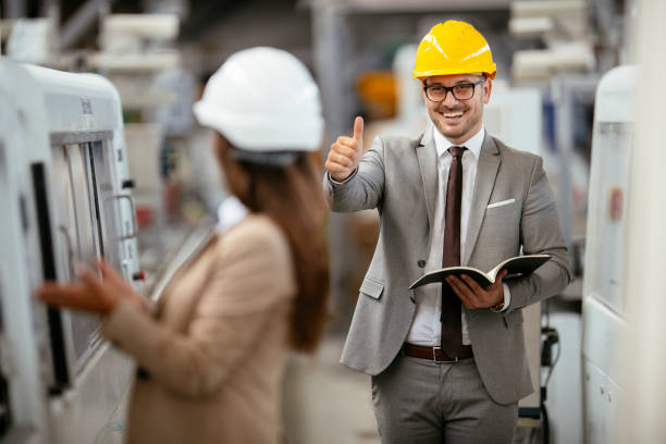 istock Colleagues working together in factory 1218906409