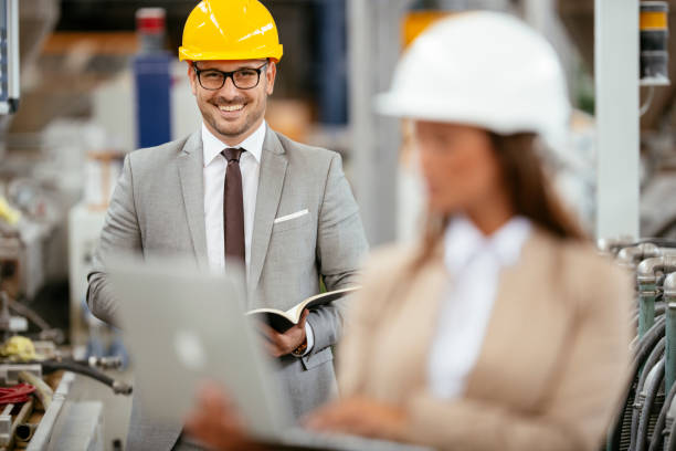 istock Colleagues working together in factory 1218906415