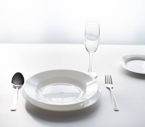 istock cutlery on the table, served by the window in an empty restaurant. as a concept for closing public spaces and restaurants during a pandemic. 1218907243