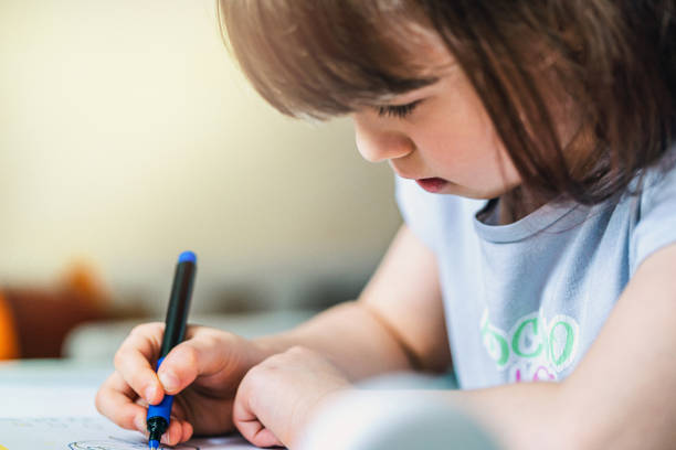 istock Cute Girl Distance Learning 1218908654