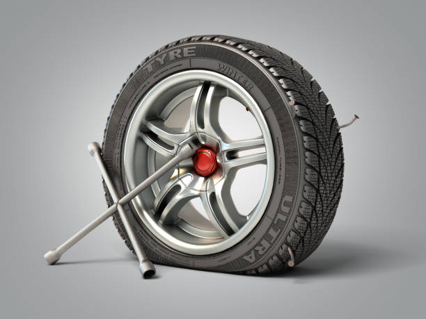 istock tire fitting concept a wheel punched with a nail and a balloon key next to it 3d render on grey gradient 1218910287