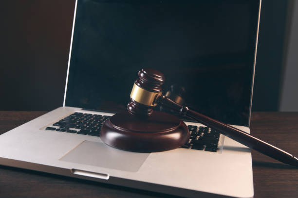 istock Gavel with books and scales on brown background 1218910414