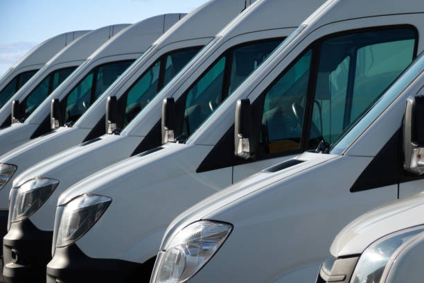 istock Commercial delivery vans, parked in a row. 1218911659