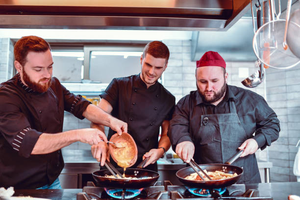 istock Restaurant Chef Team Making Good Food 1218912466