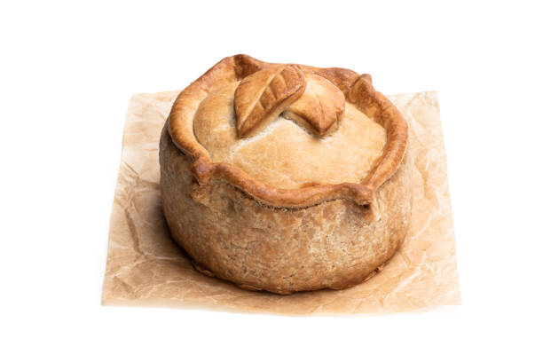 istock Seasoned cured pork and ham pie isolated on white 1218913427