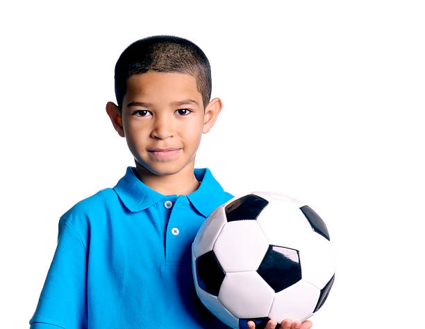 kleiner junge mit einem fußball-ball - soccer child indoors little boys stock-fotos und bilder