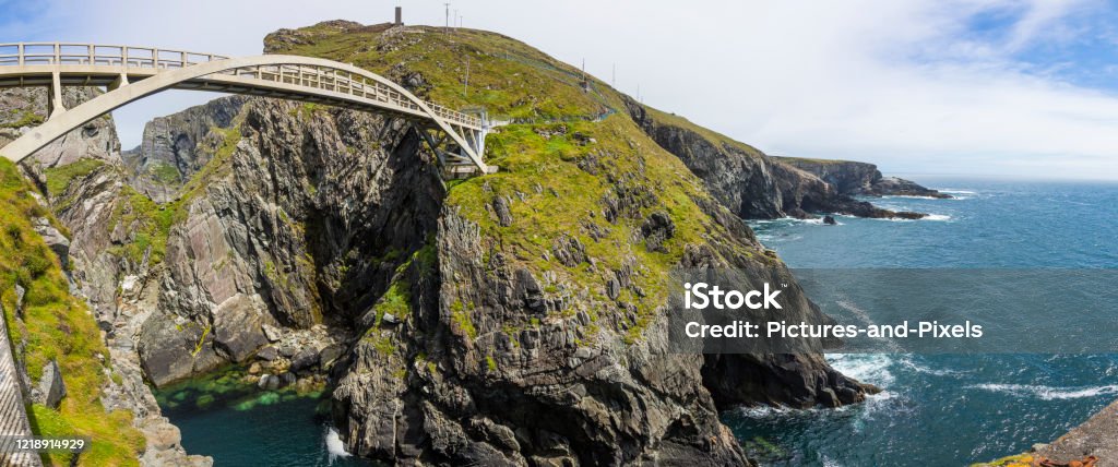 Panoramic picture of pedastrian bridge to Mizen Head lighthouse in south Ireland during daytime Panoramic picture of pedastrian bridge to Mizen Head lighthouse in south Ireland Mizen Head Stock Photo