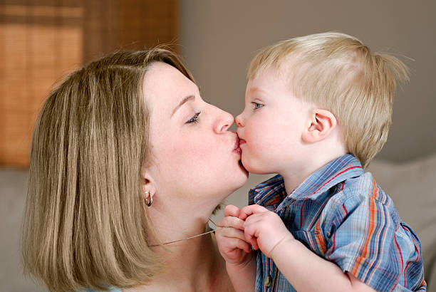 istock Mother Kissing Her Little Boy 121891591