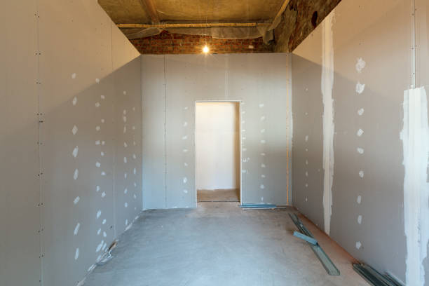 istock Working process of installing metal frames for plasterboard - drywall - for making gypsum walls in apartment is under construction, remodeling, renovation, extension, restoration and reconstruction. 1218917831