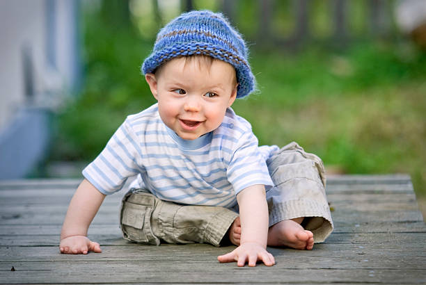 istock Happy Baby Boy Sitting Outside 121891867