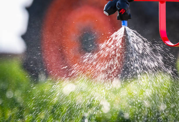 Nozzle of the tractor sprinklers sprayed. Nozzle of the tractor sprinklers sprayed. apply fertilizer stock pictures, royalty-free photos & images