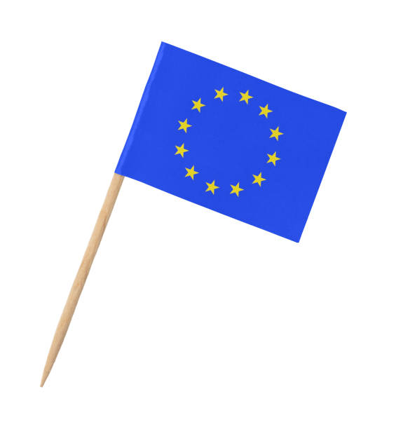 istock Small paper EU flag on wooden stick, isolated on white 1218920458