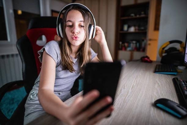 istock Girl is doing funny things at home 1218921651