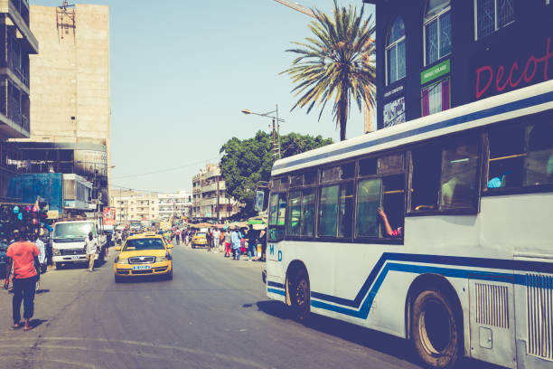 Dakar, Senegal - November 11, 2019: People working and traffic at Senegal capital Dakar, West Africa.