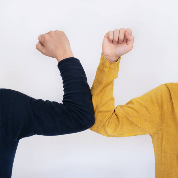 istock Elbow bump - a new and safe way of greeting 1218922804