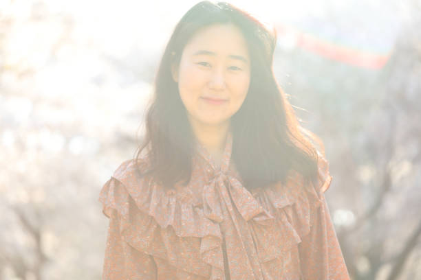 istock Asian woman with cherry blossom 1218922936