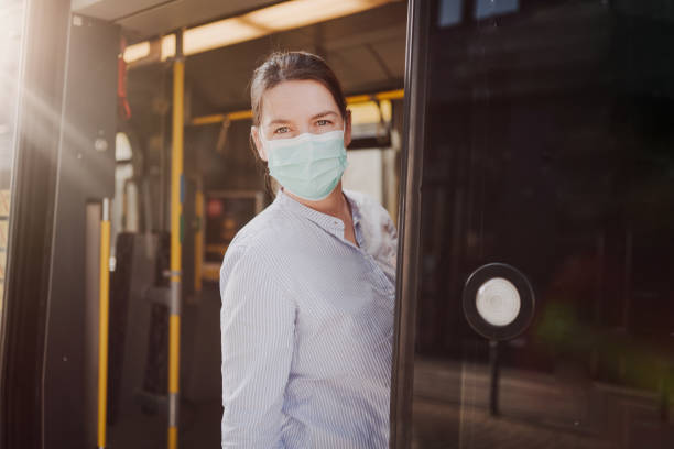 istock woman with a protective face mask using public transportation in berlin during covic-19 lock down 1218923393