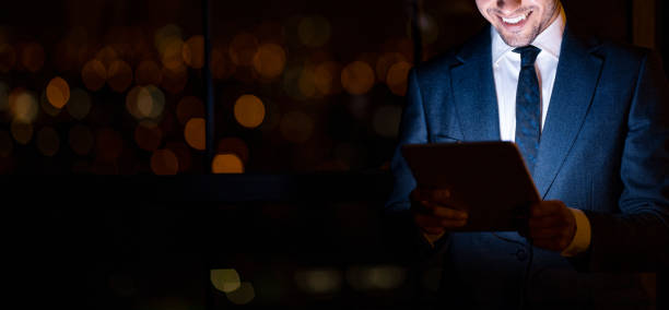 istock Unrecognizable Businessman Using Digital Tablet Standing In Office, Panorama, Cropped 1218924897