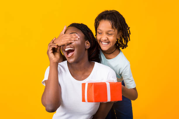Black girl congratulating her mom at studio