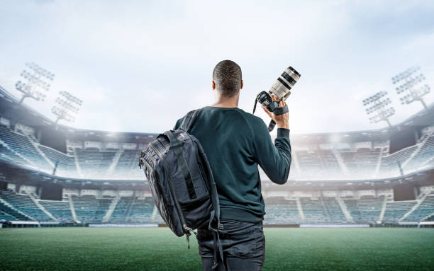 istock Sports Photographer in an empty stadium 1218926759