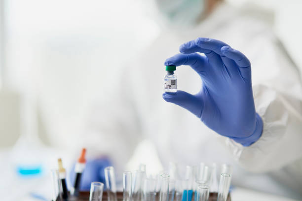 istock Hands in protective gloves holding a medical cure 1218928148