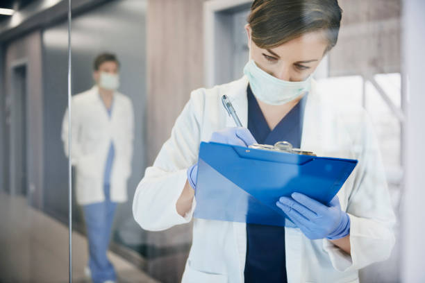 istock Busy doctor during a medical exam 1218928372