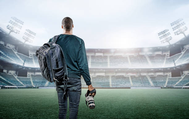 istock Sports Photographer in an empty stadium 1218929520