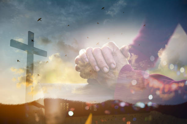 The old woman's closed hand is prayer and thank God.Christian Religion concept background. stock photo