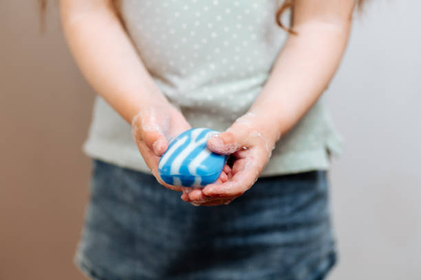 istock Little girl with soap 1218933799