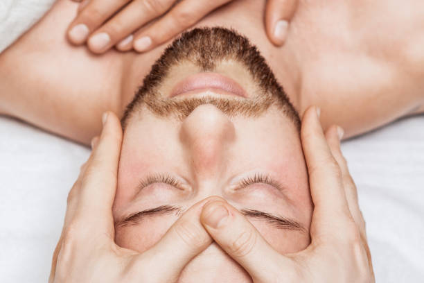 istock Man receiving relaxing head massage. 1218934772