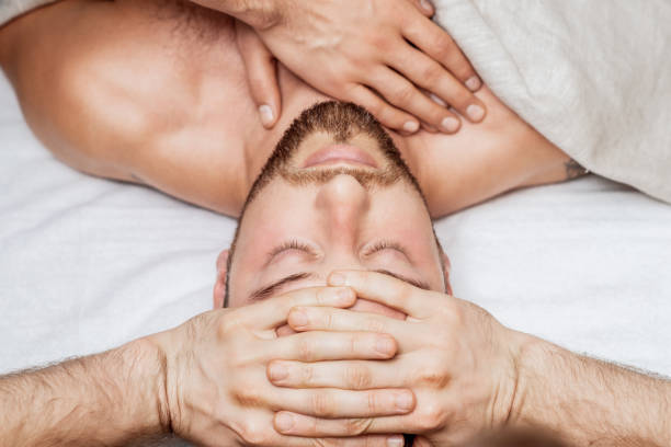 istock Man receiving relaxing head massage. 1218934790