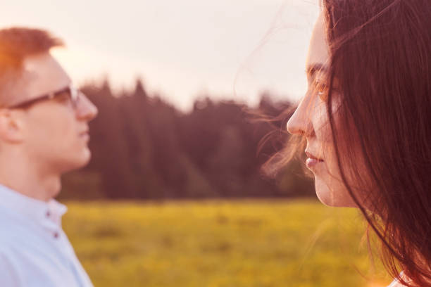 istock Loving couple in the field. Sunset. 1218940198