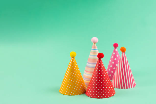 istock Colorful birthday caps on mint background. 1218943603