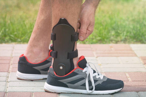 istock Man wearing ankle brace 1218944258