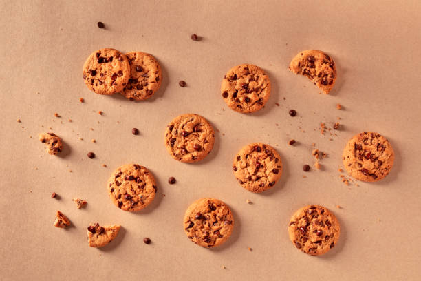 istock Chocolate chip cookies on a brown background, shot from the top 1218945227