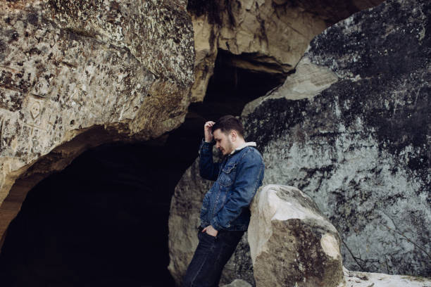 istock Sad young man alone in the mountains 1218945829