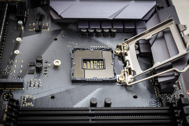 istock Closeup detail of CPU socket of a modern computer black motherboard. Electronic small component details. Select focus 1218945974