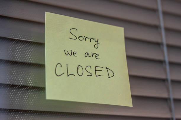 istock yellow sticker over blinds sorry we are closed 1218946239