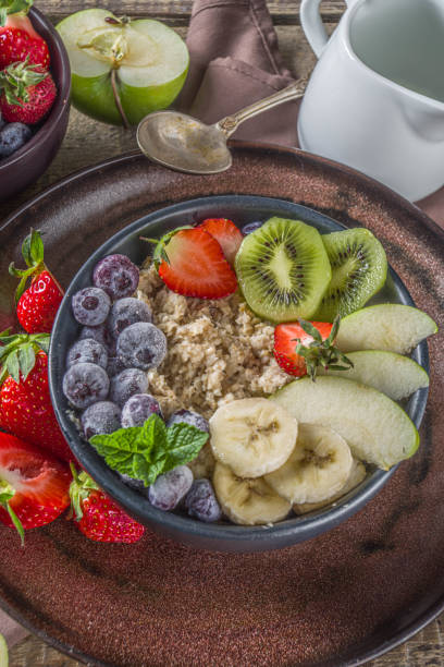 istock Breakfast oats with fruit and berry 1218947326