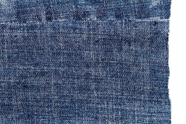 istock Piece of dark blue jeans fabric 1218947608