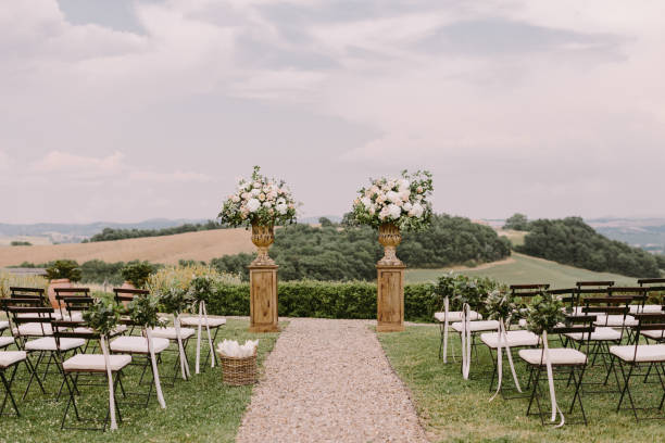 chic wedding venue in Tuscany Italy chic wedding venue in Tuscany Italy. Destination wedding venue in Tuscany, Italy. Fine art wedding photo. Luxury wedding venue in rural field area. country wedding arches stock pictures, royalty-free photos & images