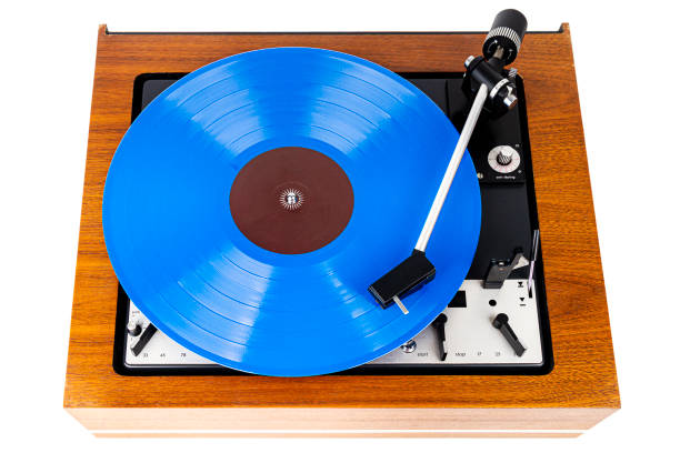 istock Vintage turntable with a blue vinyl isolated on white 1218948322